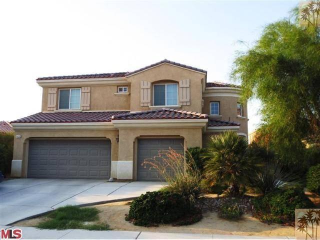 a front view of a house with garage