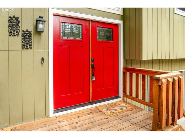 a large kitchen with stainless steel appliances granite countertop a stove a sink dishwasher and a microwave