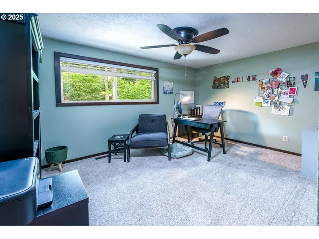 a bathroom with a granite countertop sink a large mirror and a shower