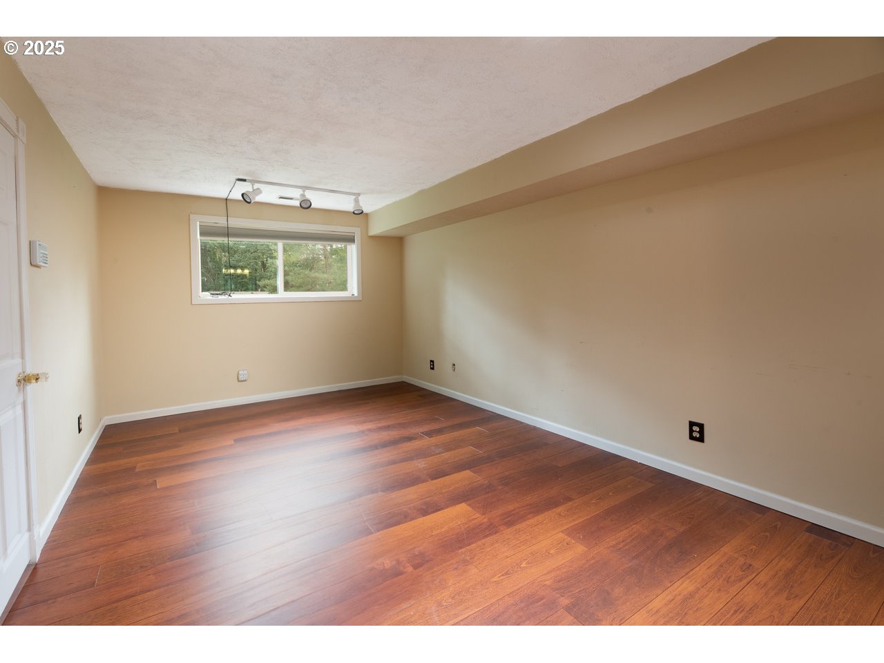 3503 Northwest Valley View Drive Albany, OR 97321 - Photo 40 of 43 a view of an empty room with wooden floor and a window