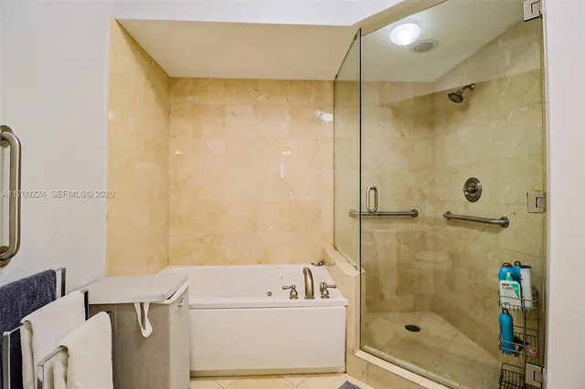 a bathroom with a granite countertop toilet a sink and a mirror