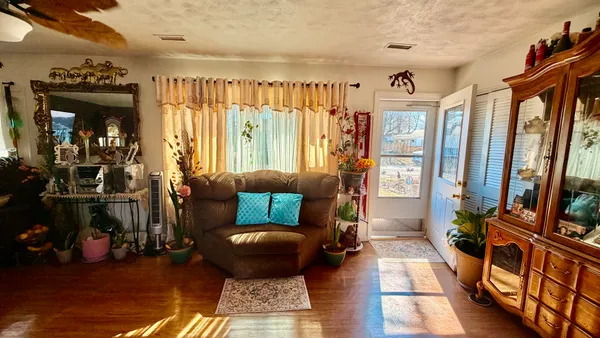 a living room with furniture and a rug