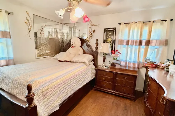 a bed room with a bed and a chandelier