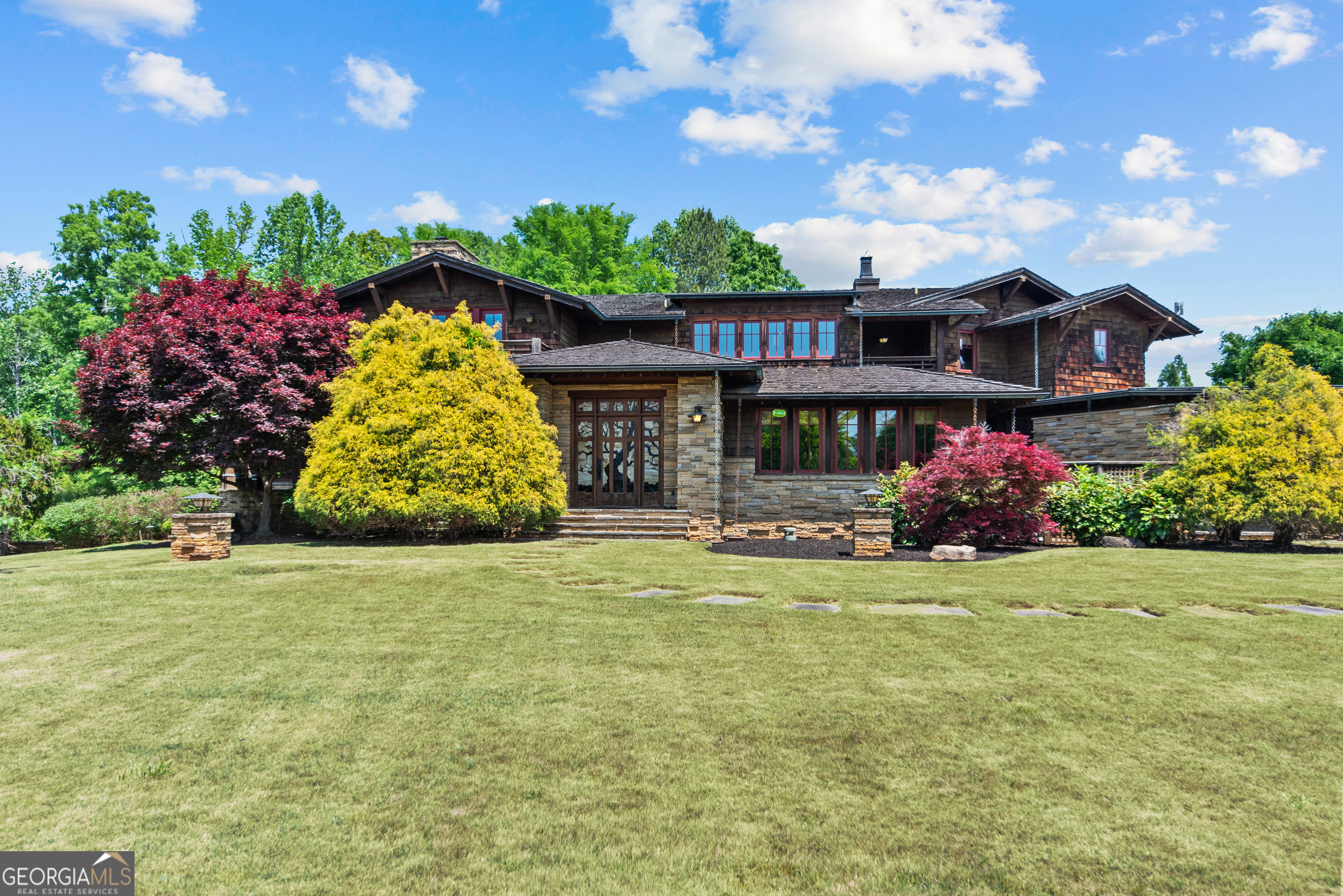 1875 Reids Ferry Road Buckhead, GA 30625 - Photo 2 of 125 a front view of a house with a big yard and potted plants