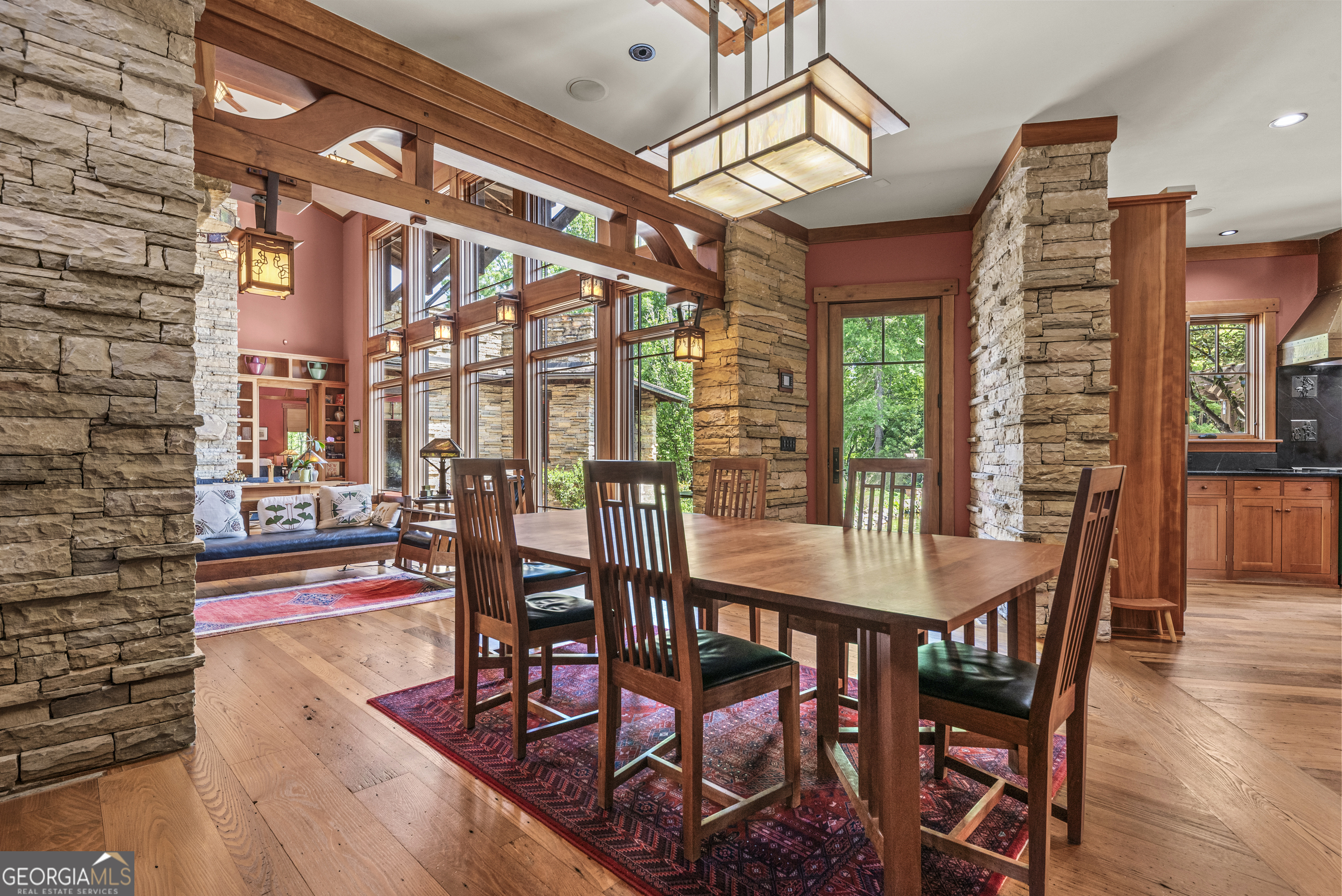 1875 Reids Ferry Road Buckhead, GA 30625 - Photo 28 of 125 a dining room with furniture a chandelier and wooden floor