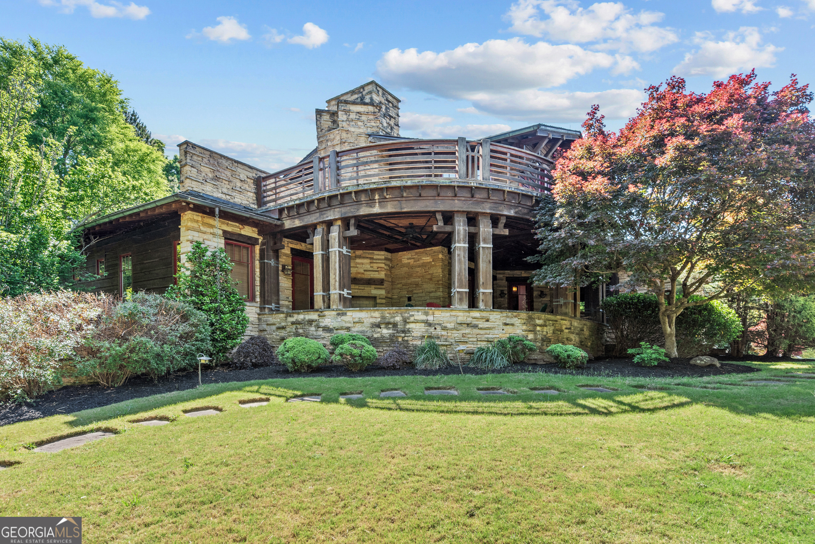 1875 Reids Ferry Road Buckhead, GA 30625 - Photo 3 of 125 a front view of a house with garden