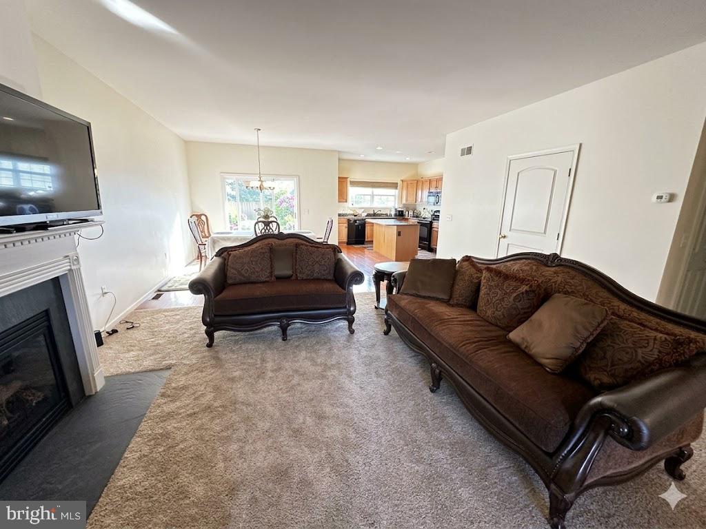 616 Petersburg Road Lancaster, PA 17601 - Photo 2 of 12 a living room with furniture a flat screen tv and a fireplace