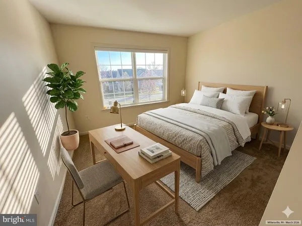 a bedroom with a bed a table and chair with the floor to bedroom
