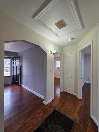 a view of livingroom with hardwood floor and hallway