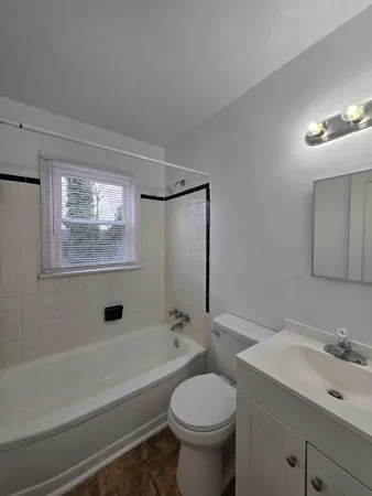 a bathroom with a sink a toilet and a bathtub