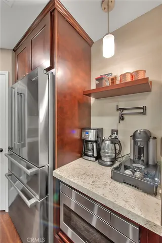 a kitchen with a refrigerator and a sink