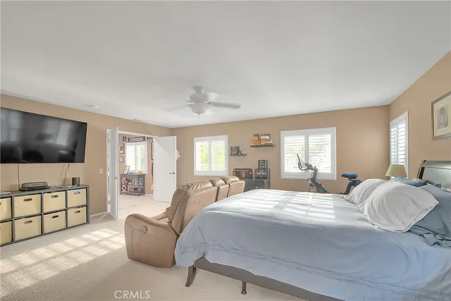 a spacious bathroom with a tub shower and window