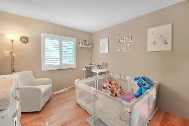 a bathroom with a toilet and a shower curtain