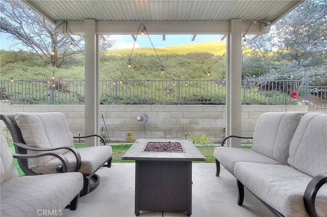 an aerial view of residential houses with outdoor space and city view