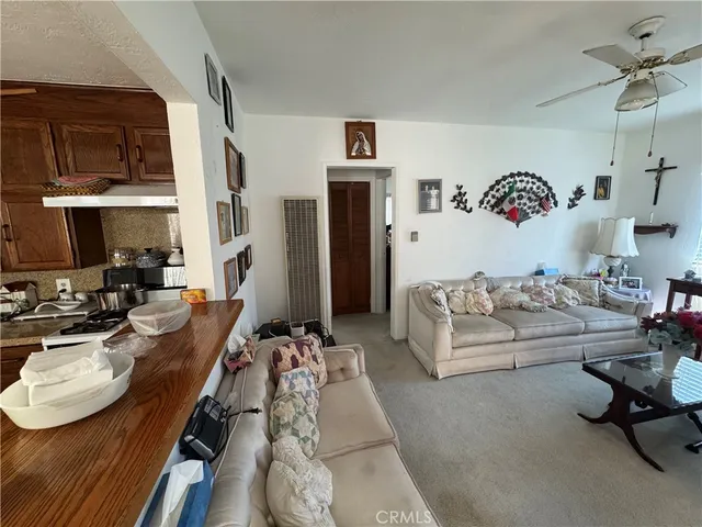 a living room with furniture rug and a window