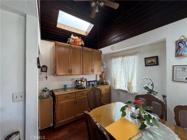 a kitchen with sink cabinets and wooden floor