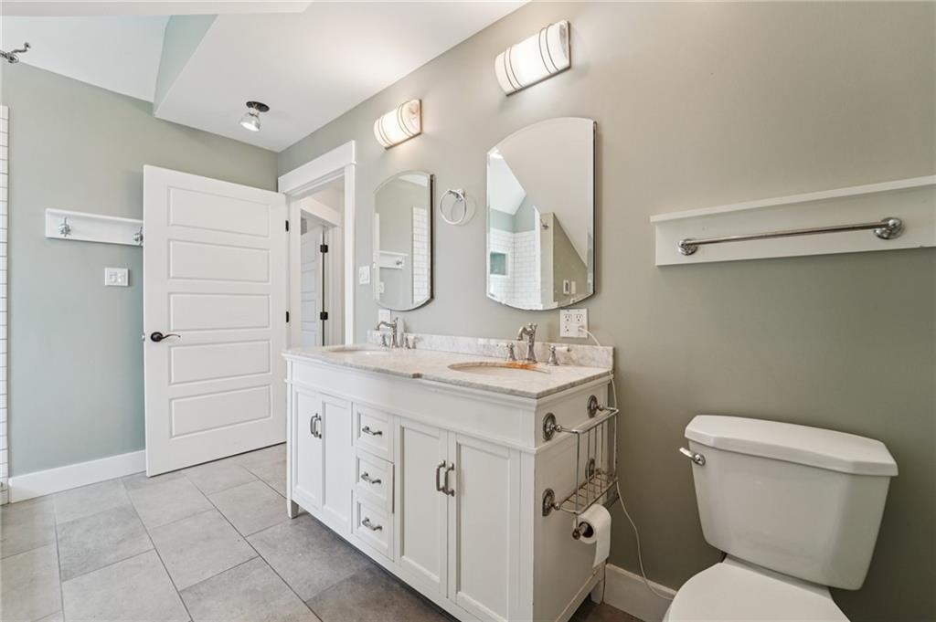 6012 Cunningham Road Gibsonia, PA 15044 - Photo 18 of 26 a bathroom with a granite countertop sink toilet and shower