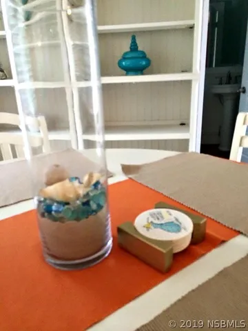 a room with a table and chairs