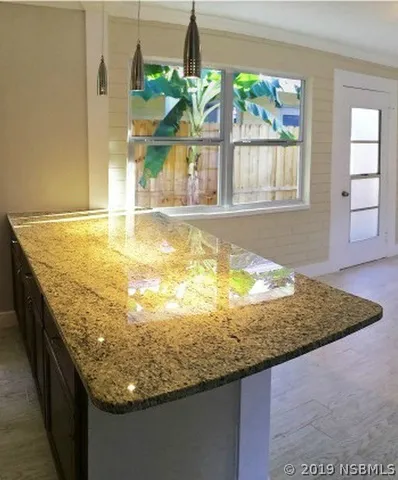 a view of a backyard with swimming pool