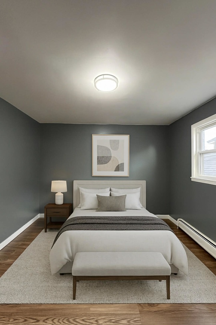 6138 South Kilpatrick Avenue, Unit 2 Chicago, IL 60629 - Photo 8 of 19 a bedroom with a bed and a night stand