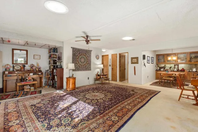 a living room with furniture and a table