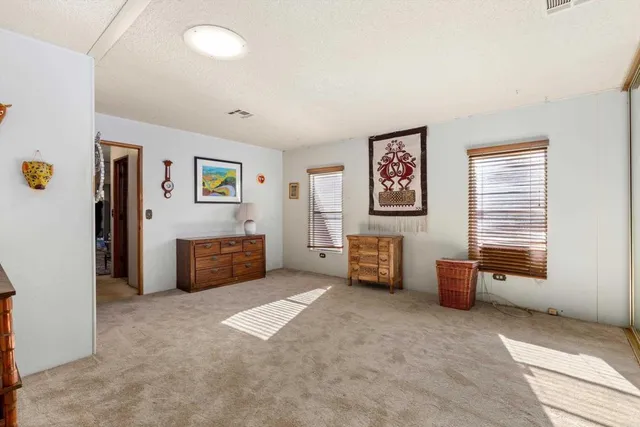 a view of livingroom with furniture and window