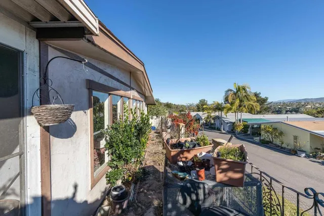 a view of a chairs and table in patio