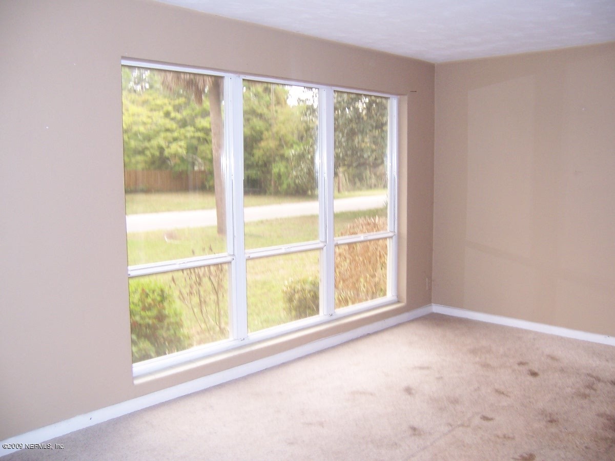 6409 Kennerly Road Jacksonville, FL 32216 - Photo 2 of 8 living room with huge windows