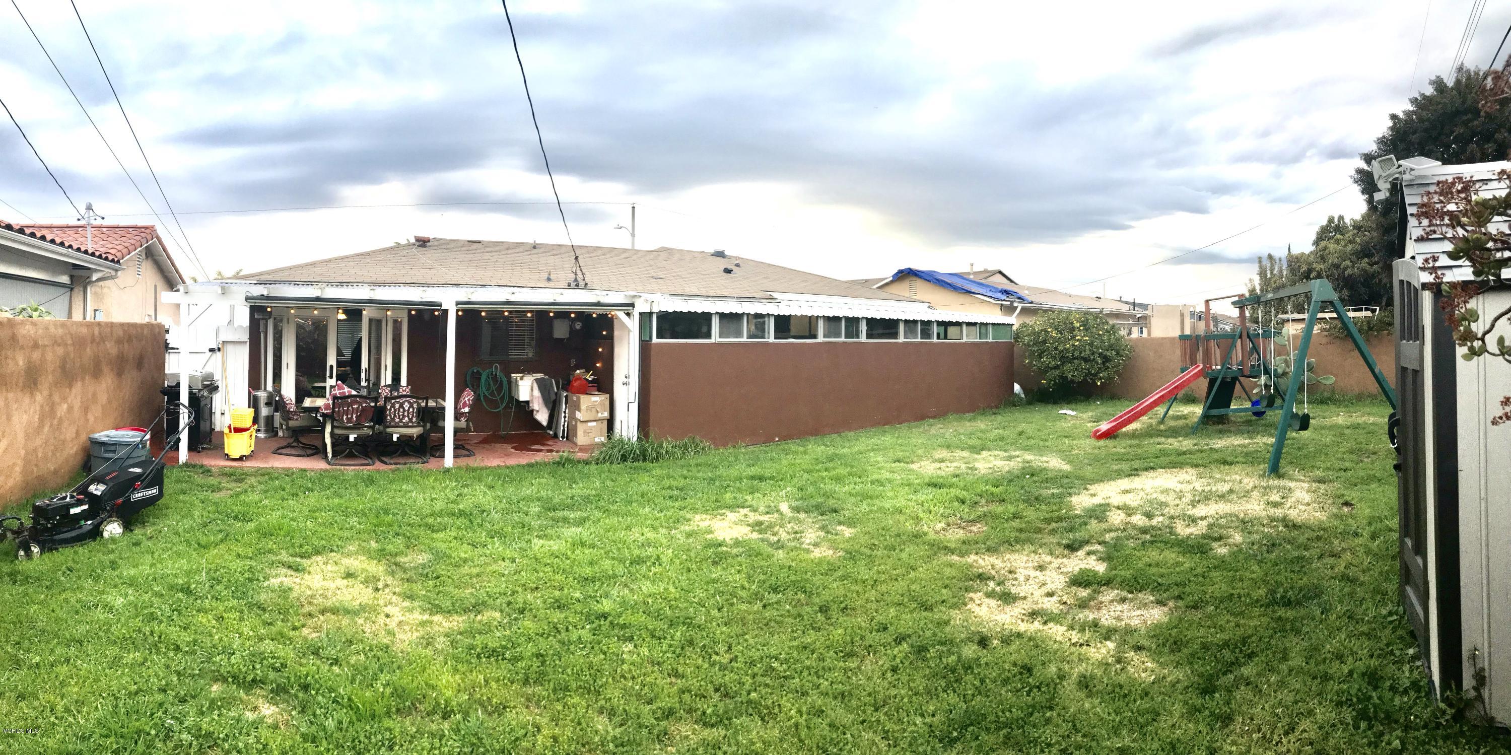4010 South J Street Oxnard, CA 93033 - Photo 11 of 18 a view of a house with a backyard and a swimming pool