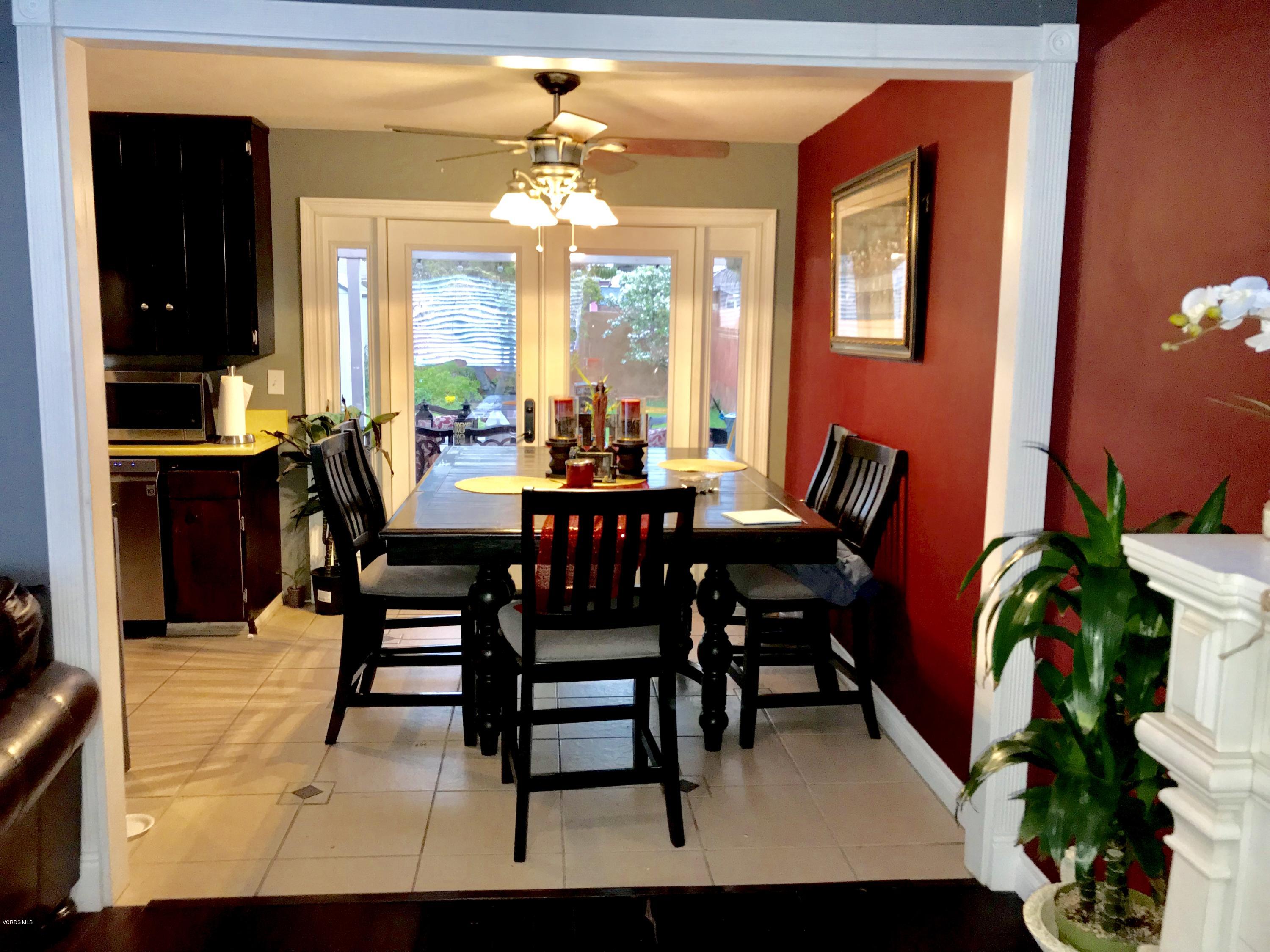 4010 South J Street Oxnard, CA 93033 - Photo 5 of 18 a view of a dining room with furniture and chandelier