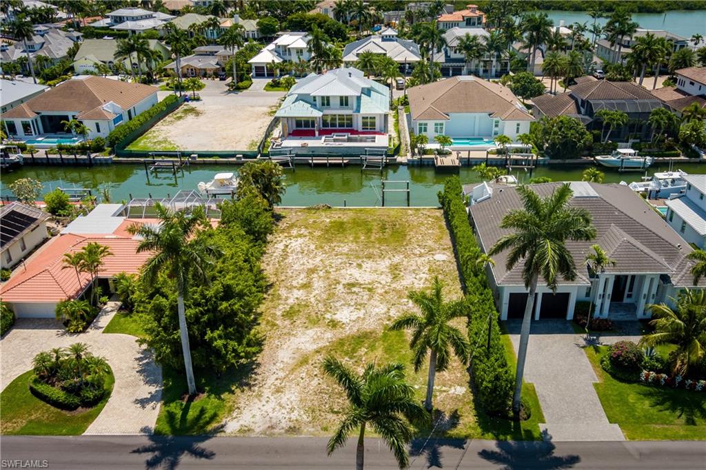 2165 Tarpon Road Naples, FL 34102 - Photo 11 of 24 an aerial view of a house with outdoor space and lake view
