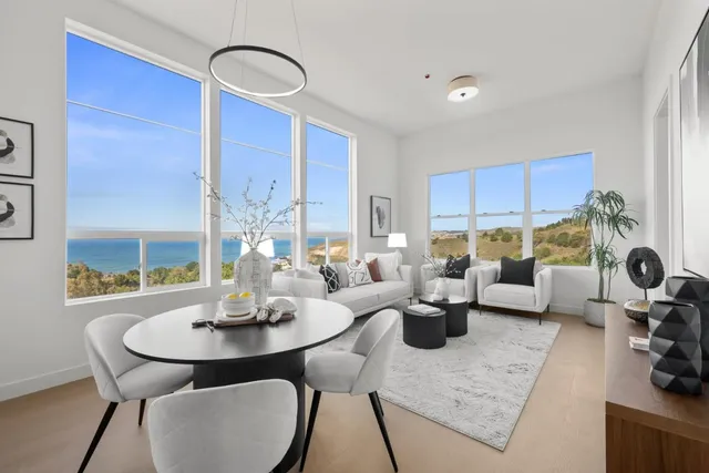 a view of a dining room with furniture window and outside view