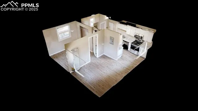 a view of living room with furniture and wooden floor