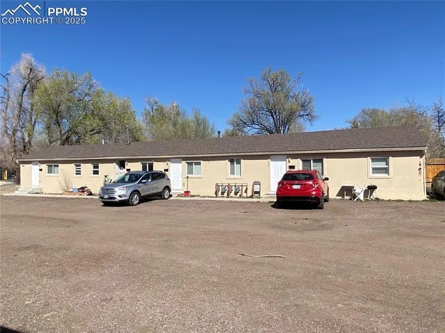 a view of a car is parked on the side of the road