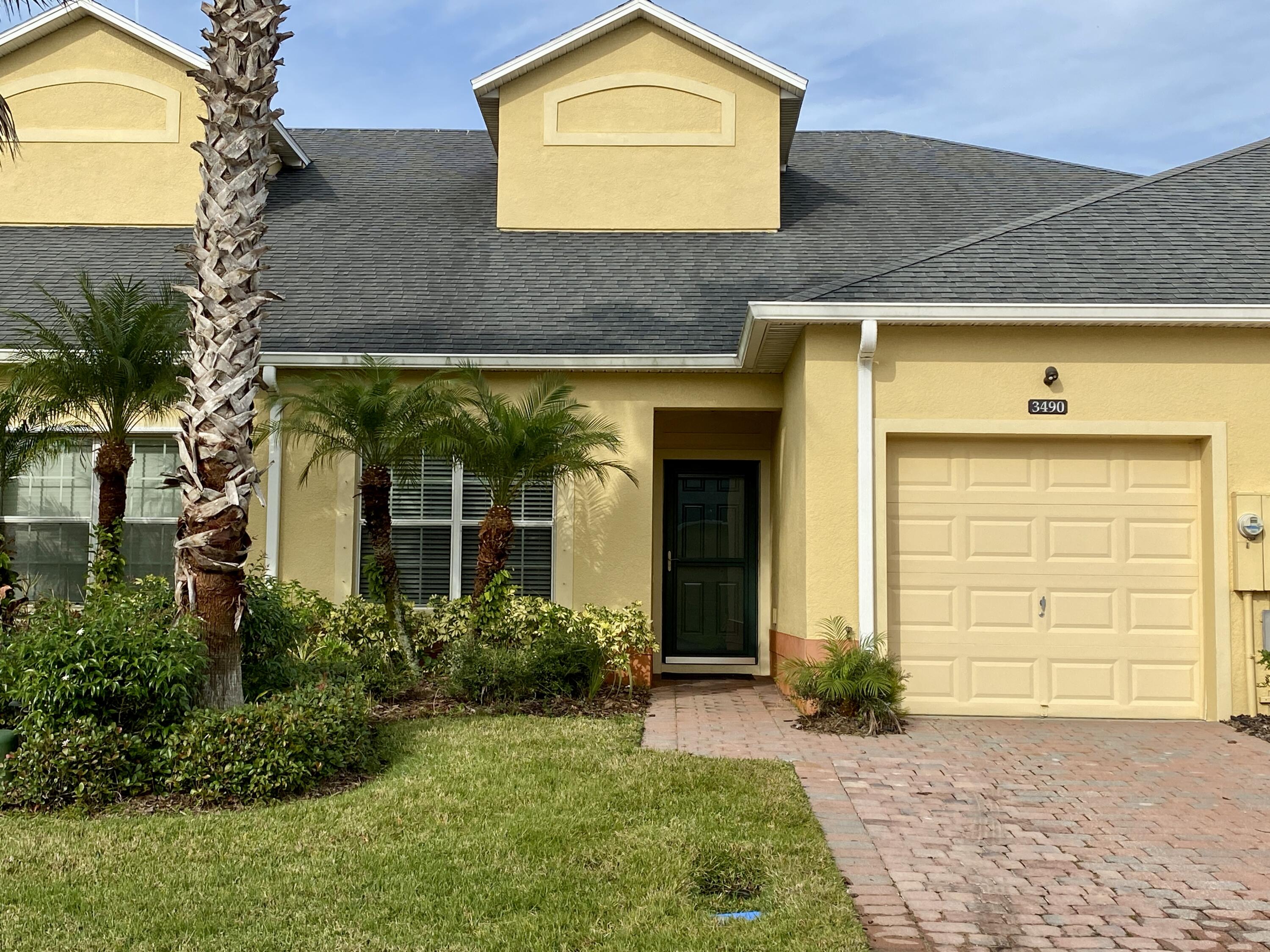3490 Funston Circle Melbourne, FL 32940 - Photo 1 of 25 a front view of a house with a yard