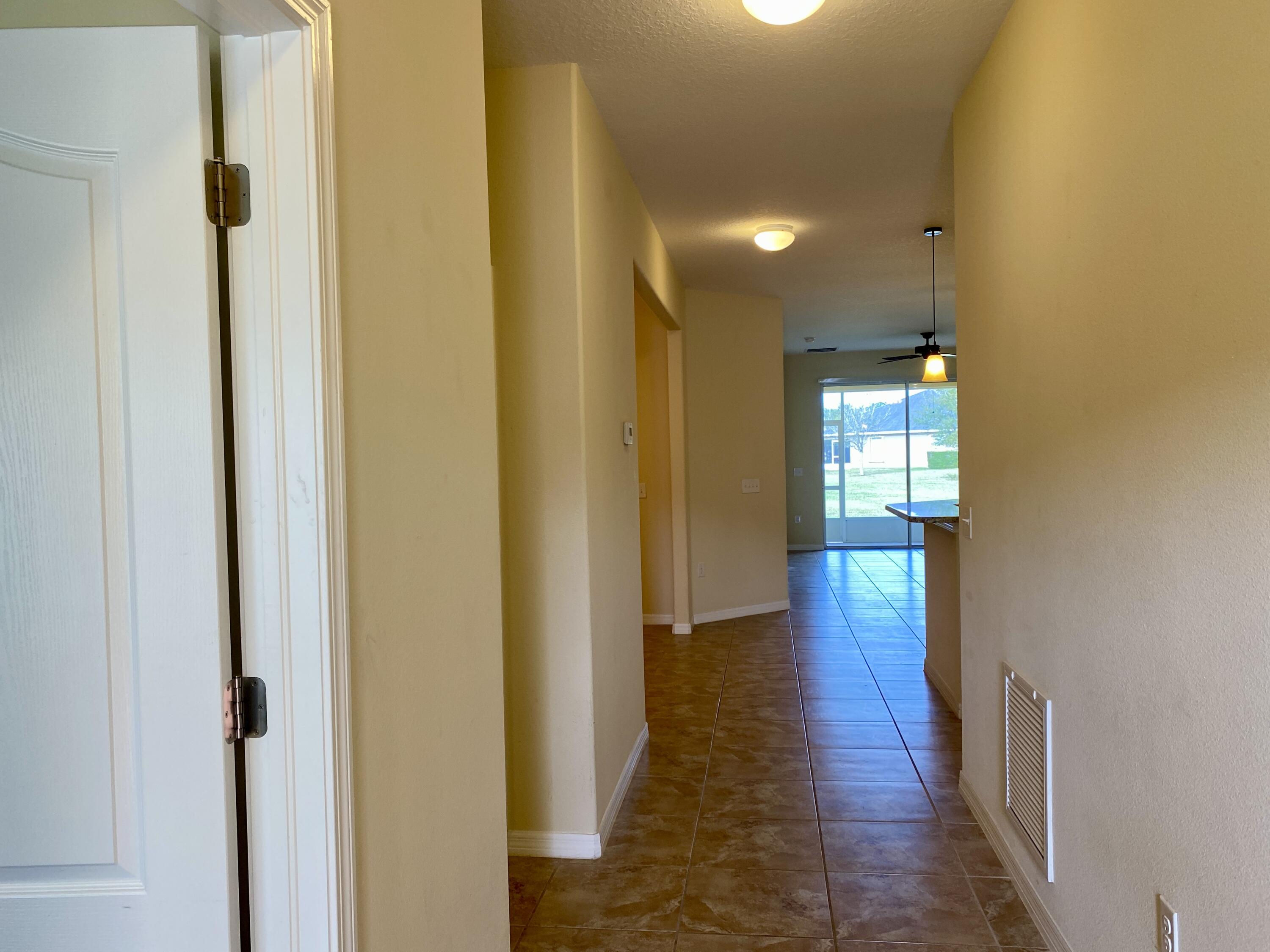 3490 Funston Circle Melbourne, FL 32940 - Photo 23 of 25 a view of a hallway with wooden floor