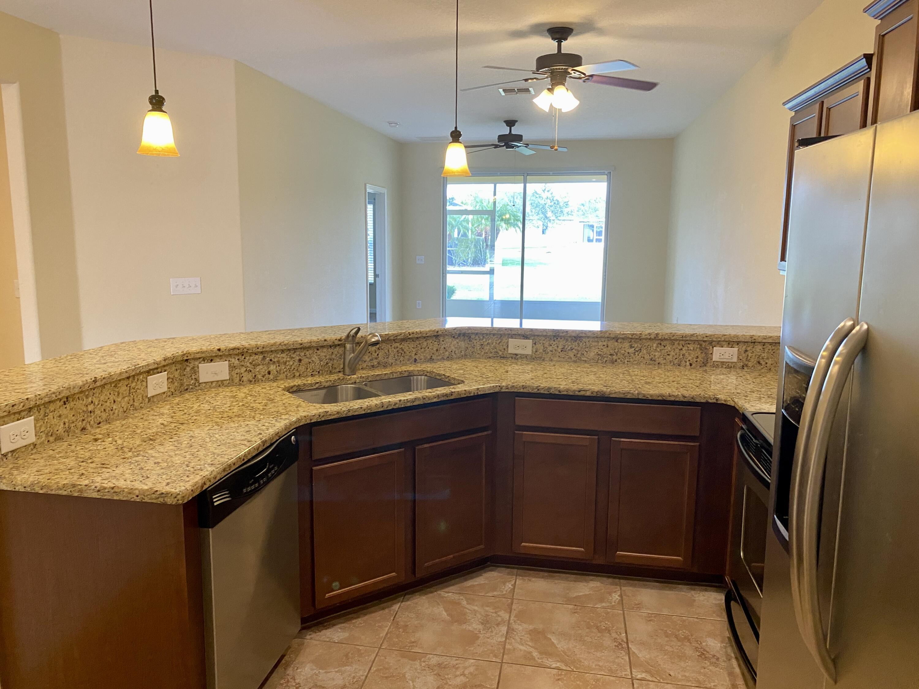 3490 Funston Circle Melbourne, FL 32940 - Photo 3 of 25 a bathroom with a granite countertop sink and a mirror
