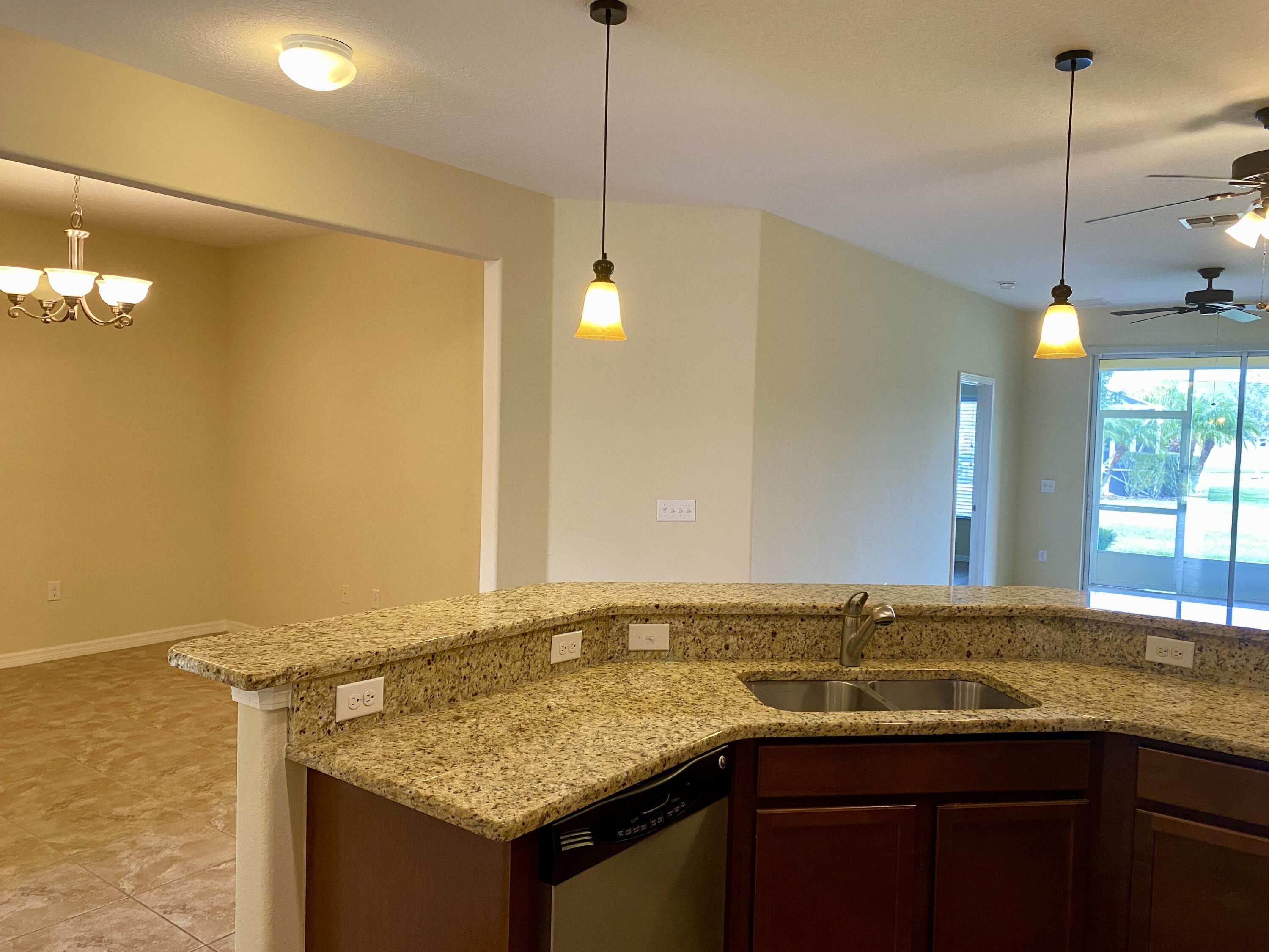 3490 Funston Circle Melbourne, FL 32940 - Photo 5 of 25 a bathroom with a granite countertop sink and a mirror