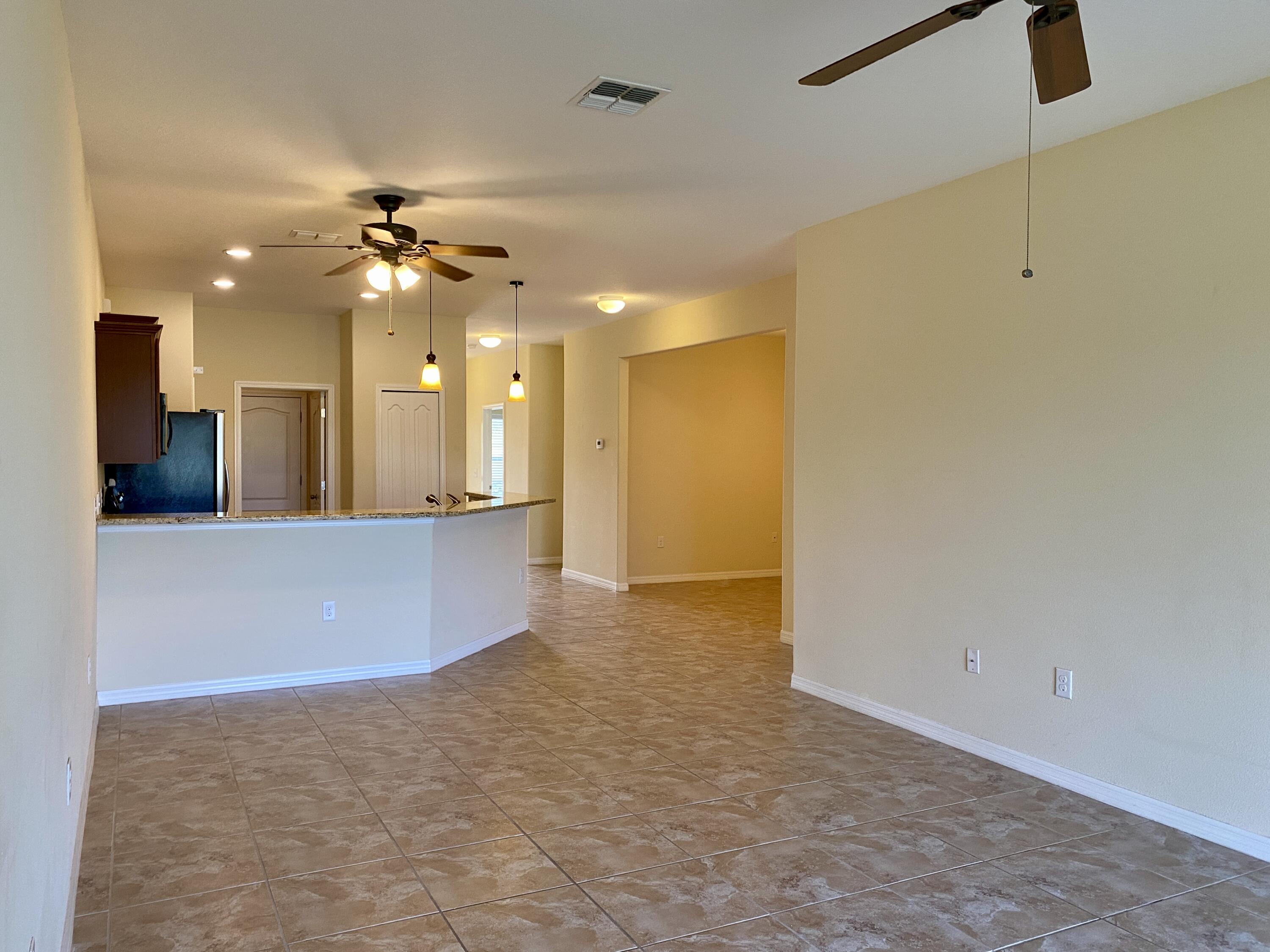3490 Funston Circle Melbourne, FL 32940 - Photo 9 of 25 a view of an empty room and kitchen view