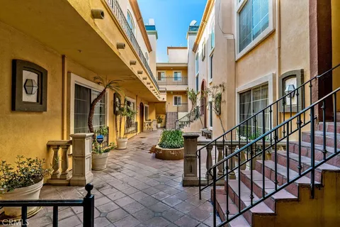 a view of an chair and table in the balcony