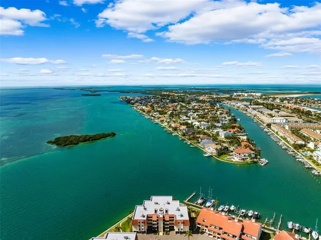 an aerial view of houses with outdoor space