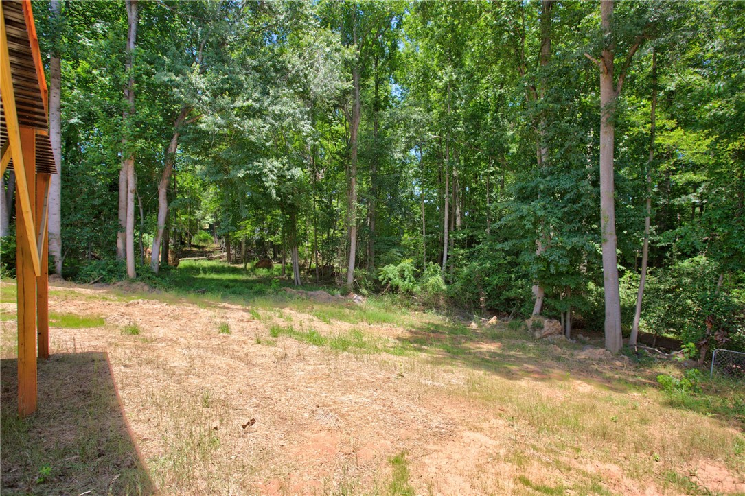 223 Maple Drive Anderson, SC 29621 - Photo 38 of 45 Mature trees frame a private yard with ample space for outdoor enjoyment.
