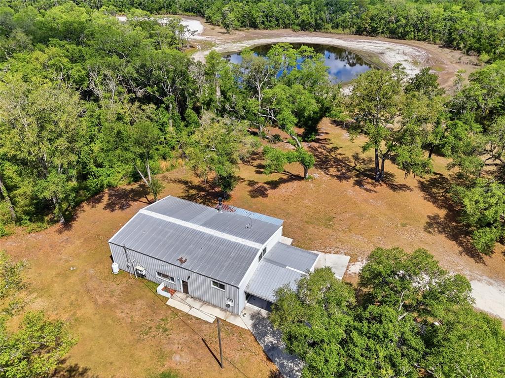 401 Southeast Falcon Road Branford, FL 32008 - Photo 16 of 76 an aerial view of a house with yard and swimming pool