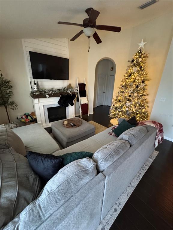 2318 Tanbark Ridge Place, Unit 2318 Plant City, FL 33563 - Photo 16 of 64 a living room with furniture and a flat screen tv