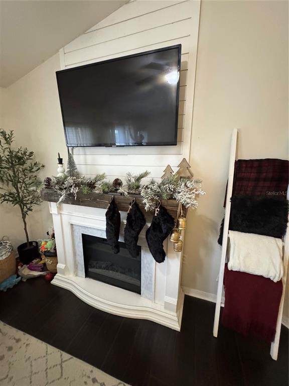 2318 Tanbark Ridge Place, Unit 2318 Plant City, FL 33563 - Photo 17 of 64 a living room with furniture and a flat screen tv