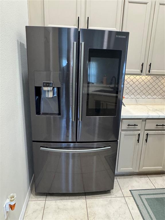 2318 Tanbark Ridge Place, Unit 2318 Plant City, FL 33563 - Photo 22 of 64 a metallic refrigerator freezer sitting in a kitchen