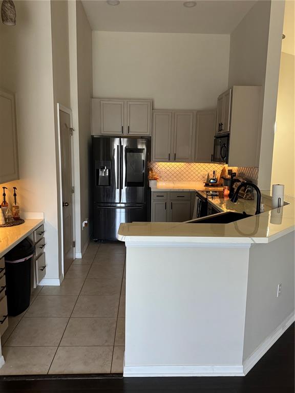 2318 Tanbark Ridge Place, Unit 2318 Plant City, FL 33563 - Photo 26 of 64 a kitchen with stainless steel appliances a refrigerator and a stove