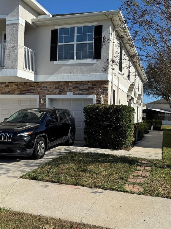 2318 Tanbark Ridge Place, Unit 2318 Plant City, FL 33563 - Photo 3 of 64 a car parked in front of a house