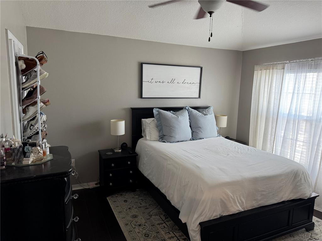 2318 Tanbark Ridge Place, Unit 2318 Plant City, FL 33563 - Photo 32 of 64 a bedroom with a bed and a window