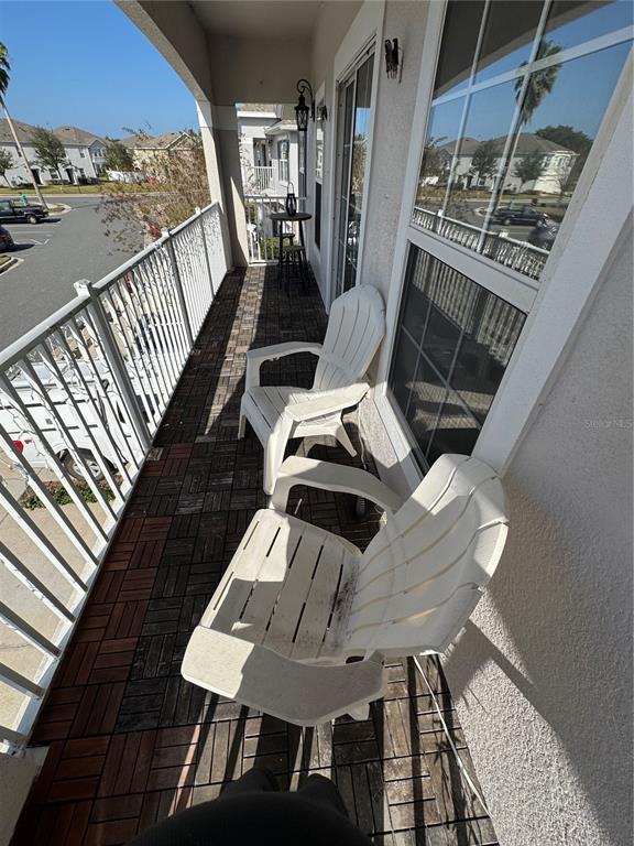 2318 Tanbark Ridge Place, Unit 2318 Plant City, FL 33563 - Photo 47 of 64 a view of a balcony dining area with furniture